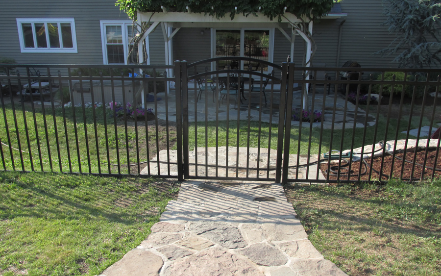 Aluminum fencing aligned with pool decking and property lines